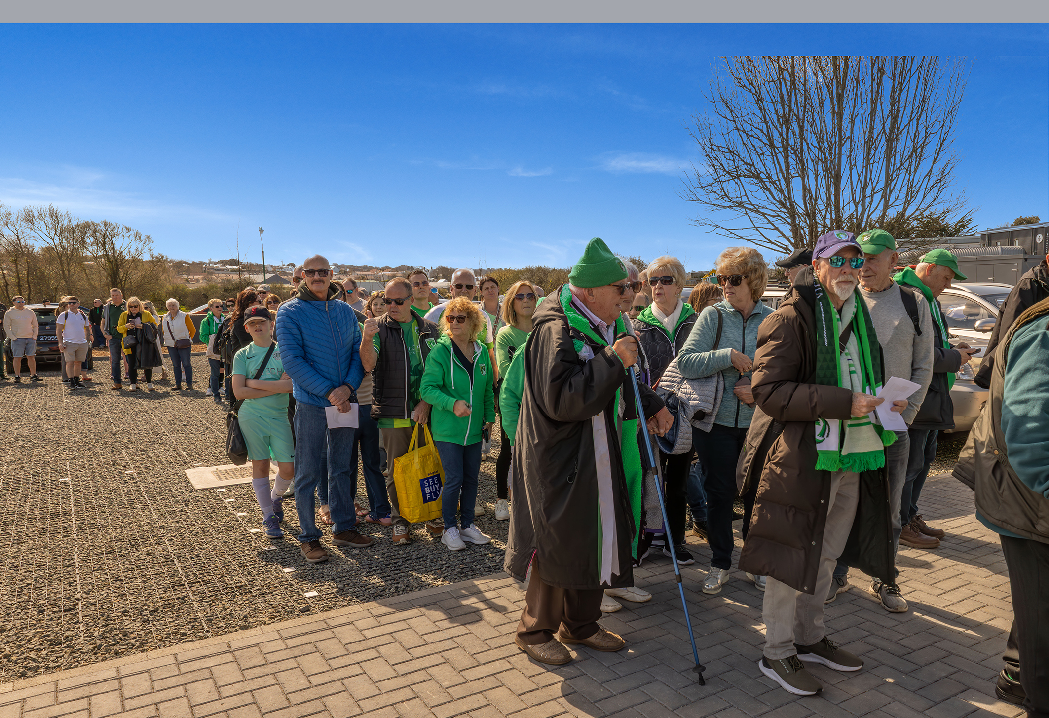 A queue of football fans waiting to get in to Victoria Park